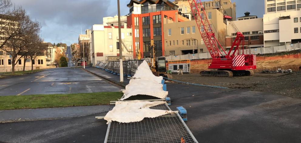 High winds knocked down a security fence at a building site near Dunedin's Queens Gardens on...