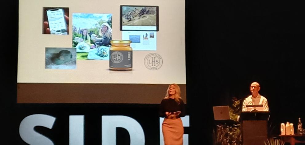 Entrepreneur Justine Ross addresses the crowd at South Island Dairy Event, watched by her husband...