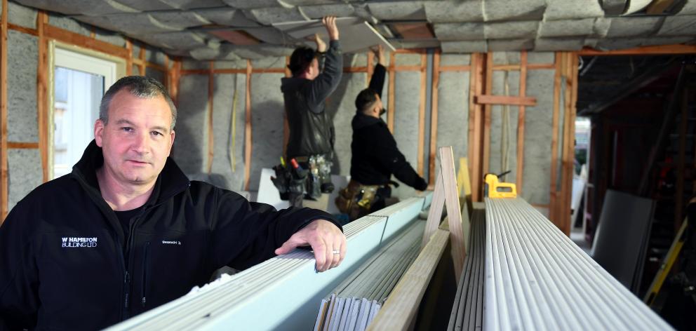 Builder Bill Hamilton, of Dunedin, with Gib which was ordered for a new build two days before the...