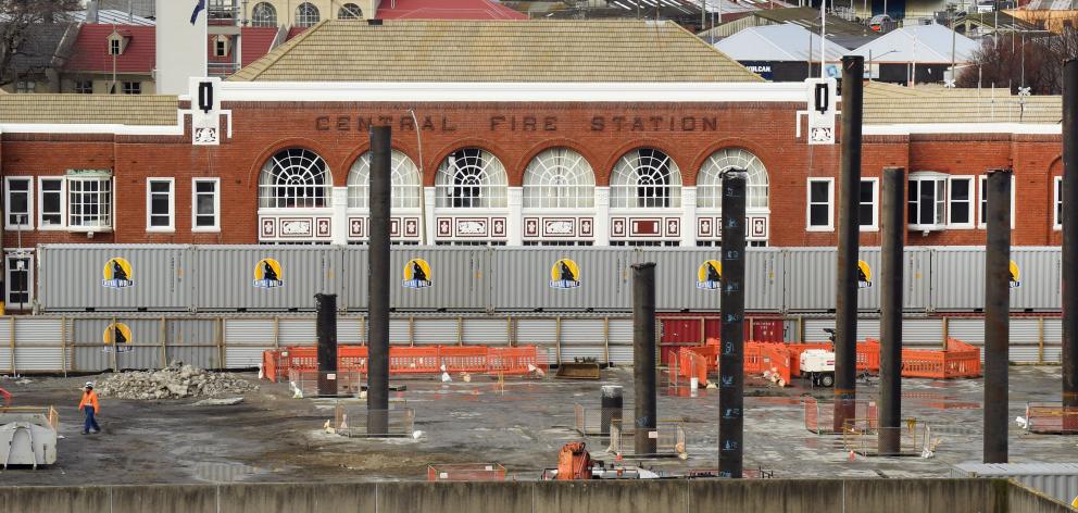Dunedin’s historic Central Fire Station is partially hidden behind containers placed on the...