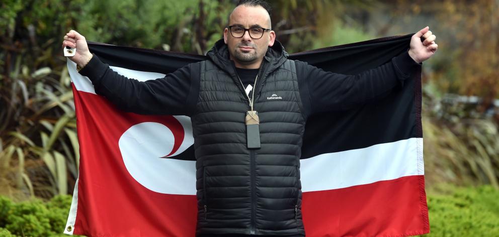 Ezra Tamati holds the tino rangatiratanga flag after succeeding in his campaign for it to be...