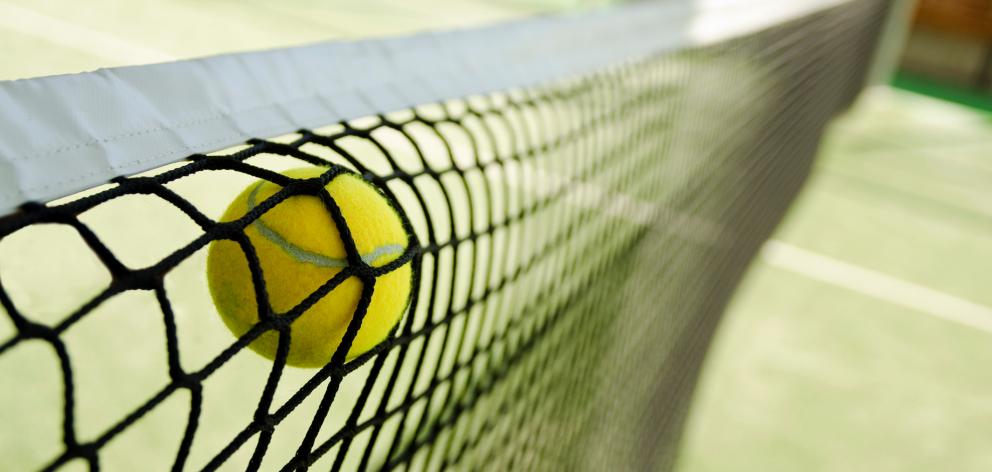Close-Up Of Tennis Ball Hitting Net. Photo: Getty Images