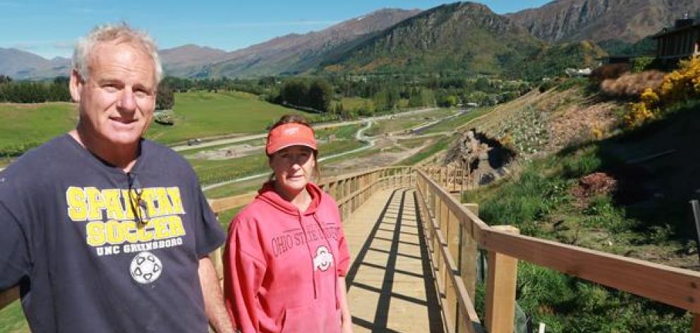 Derek and Anna Brown on the boardwalk outside their Arrowtown house in 2019. Photo: Mountain Scene