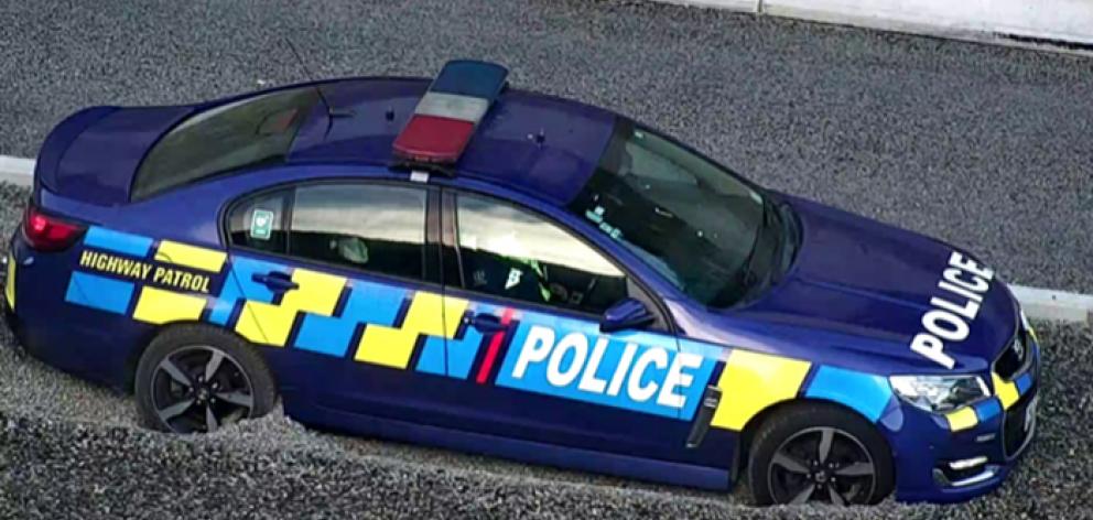 One of the Holdens in the gravel of the Transmission Gully escape lane. Photo: NZ Police