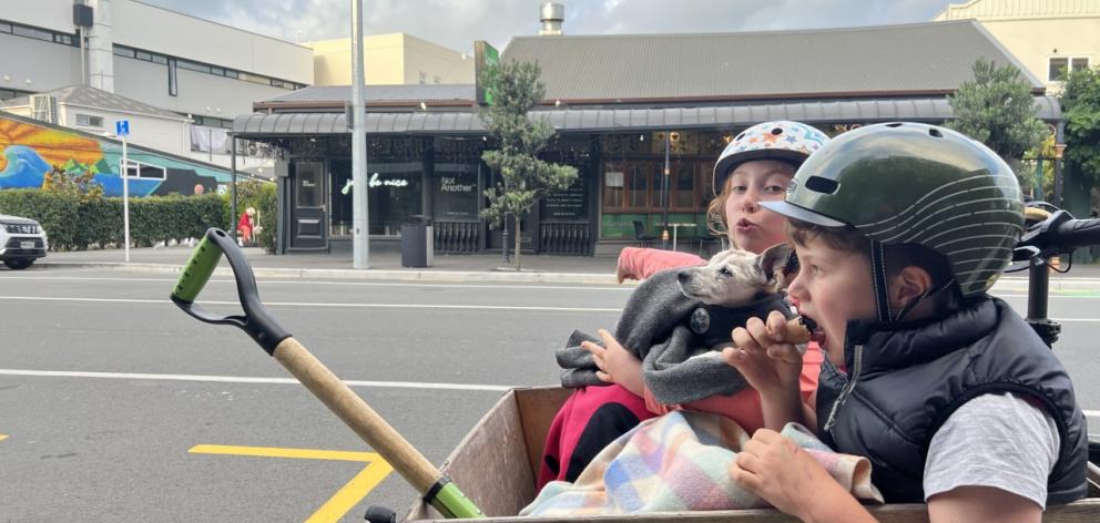 Al Duncan taking Neema and Malo (front) to school. Photo: Supplied