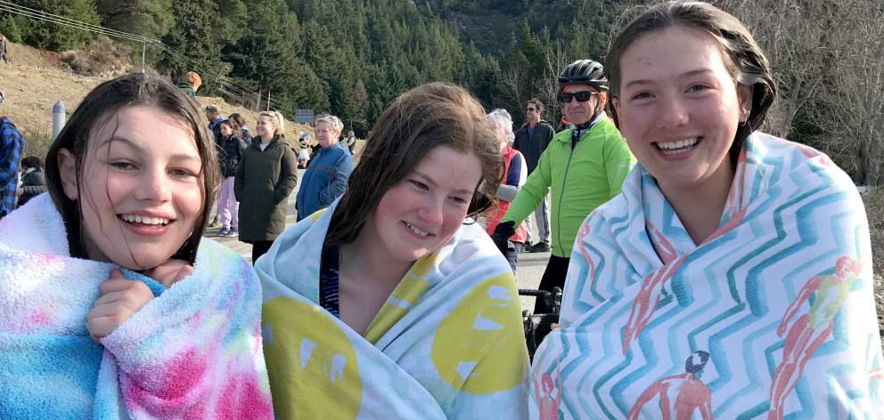 Wrapped up in towels after taking the Lake Hawea polar plunge yesterday are (from left) Lydia...