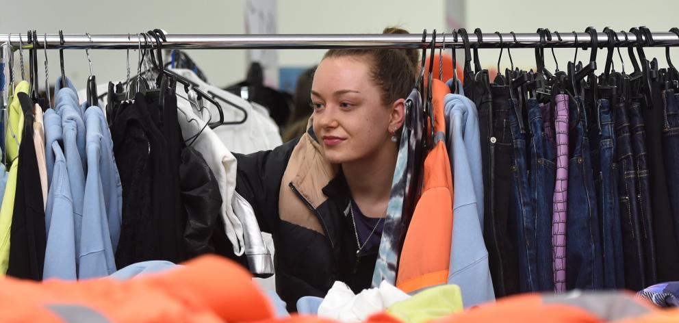 Christchurch resident Maeve Cleary hunts for bargins at a pop-up sale hosted to raise money for...