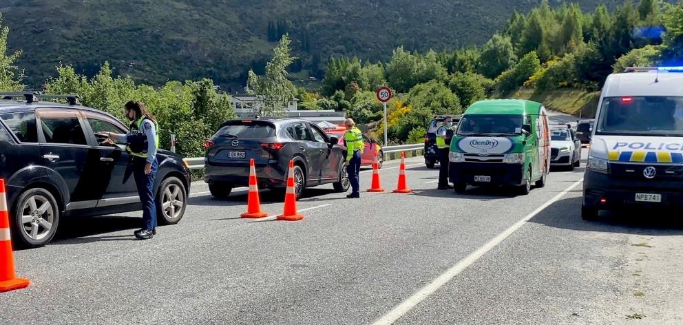 The Otago Lakes Central safer roads team conducts a breath-screening checkpoint in Arthurs Point....