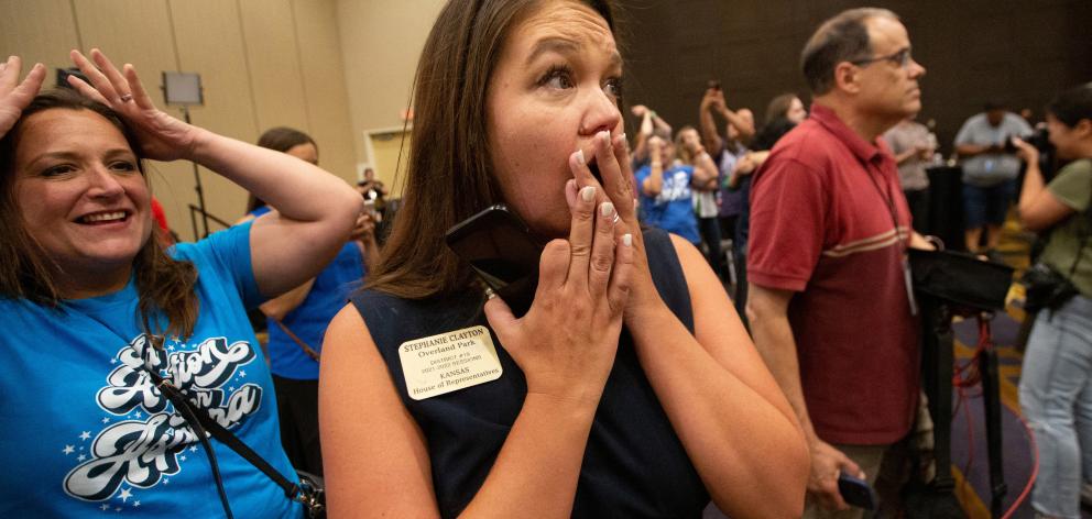 State Rep. Stephanie Clayton (D-Overland Park) reacts to the news that voters rejected a state...