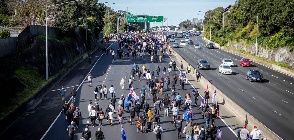 Protesters from Brian Tamaki's Freedom and Rights Coalition bring Auckland's motorway to a halt...