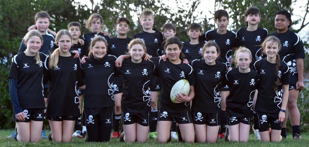The Pirates year 7 rugby team at Hancock Park yesterday (front from left) Lily Gordon, True...