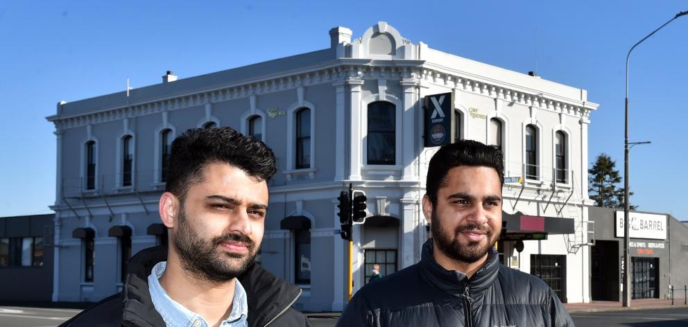 Crofters Bar manager Sukhvinder Singh (left) and Big Barrel Mosgiel manager Rehbar stand outside...