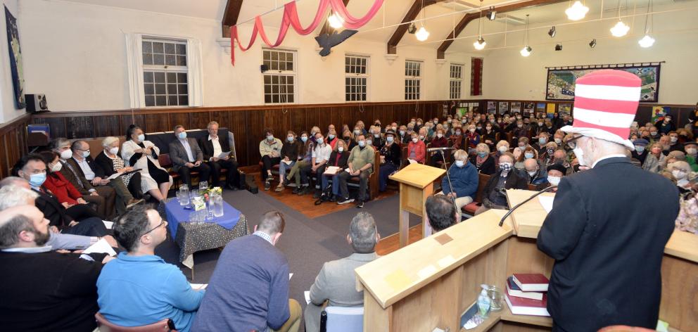 Phil Somerville (right), dressed in his Cat in the Hat attire, addresses a full hall at the Opoho...