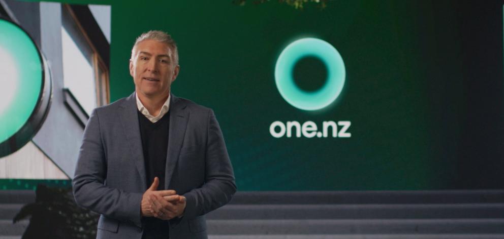 Vodafone CEO Jason Paris with the new "One NZ" branding, which will come into effect early next...