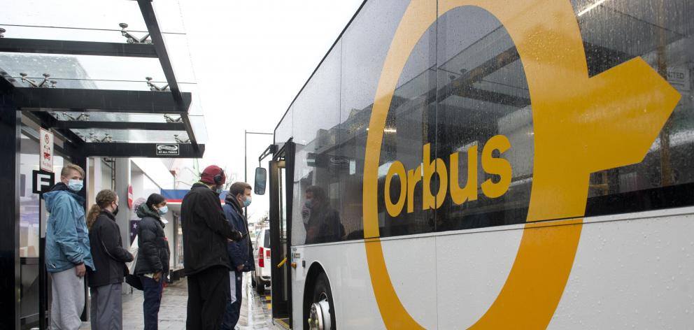 Commuters board their bus at the bus hub in Great King St. PHOTO ODT FILES