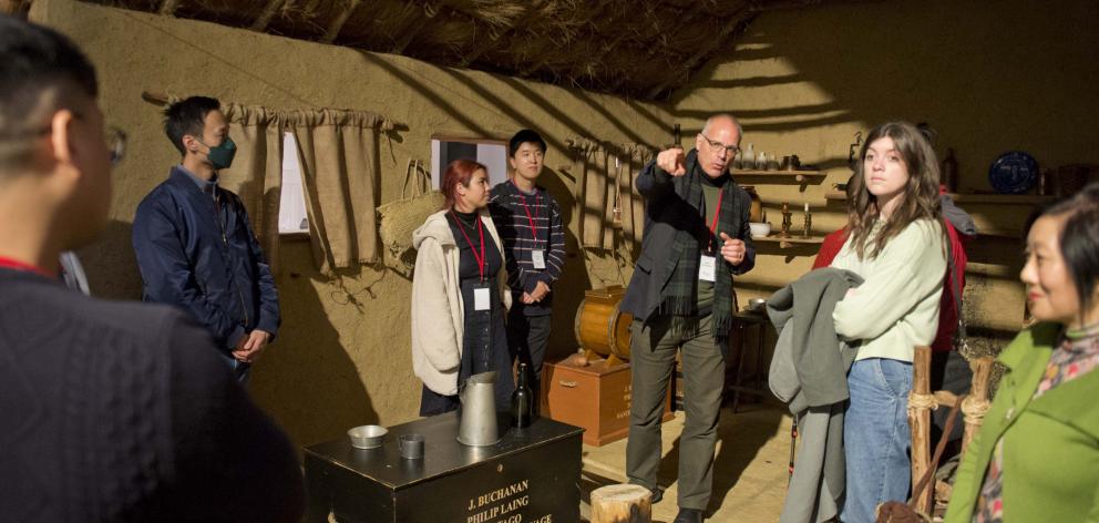 Toitu Otago Settlers Museum curator Sean Brosnahan shows some of the Chinese history on display...