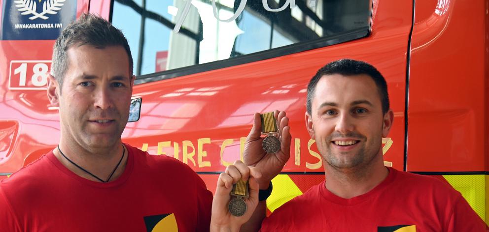 Senior Firefighters Morgan Meyers (left) and Jake Wansink, of Dunedin, who received the Australia...