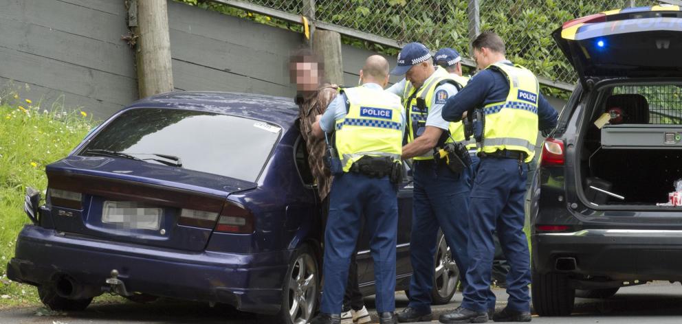 A man is taken into custody by police after a crash on George St. Photo: Gerard O'Brien 