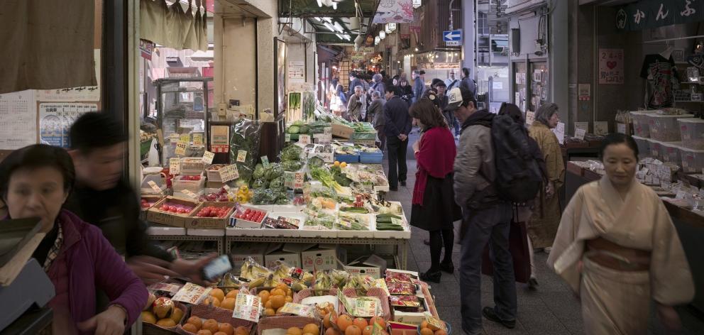 More than 100 stallholders ply their wares at the Nishiki Market, in the heart of downtown Kyoto.