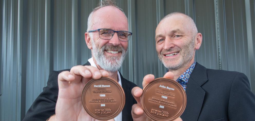 Former Otago rowers Dave Hanan (left) and John Bayne show off the special medals they received at...