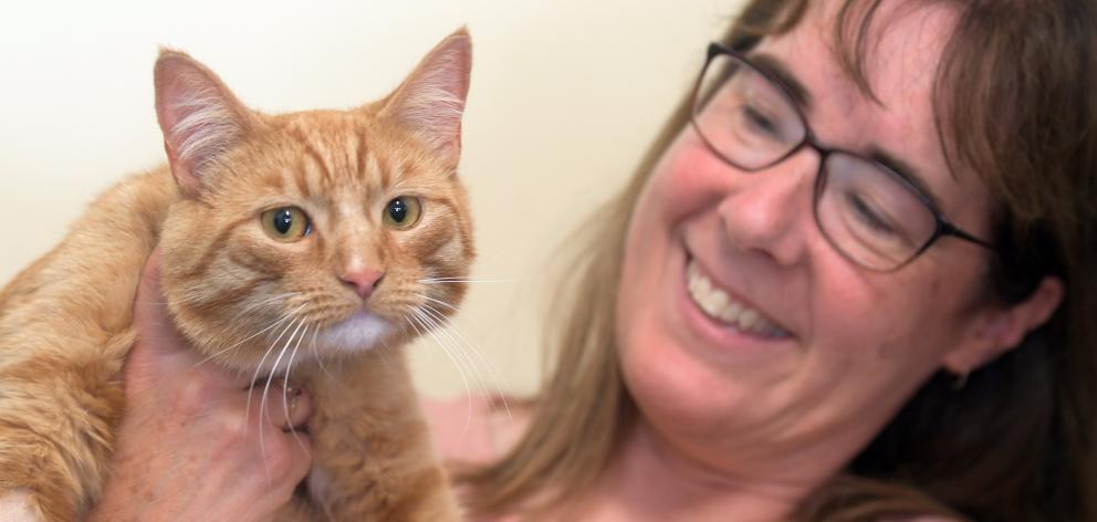 Helensburgh Veterinary Clinic owner Nicola Dunlop gives Leo a quick cuddle after he had the snip...
