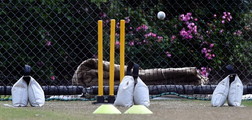 The 
weight bags are positioned at the wide lines and where the batsman’s 
toes would be.