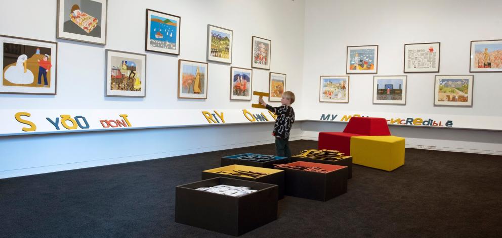 A young visitor enjoys "You Spy, Eye Spy Ōtepoti", an exhibition of works by the late Dunedin...