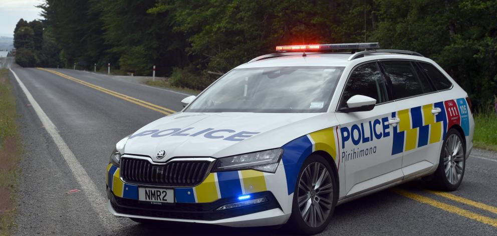 A police Skoda Superb station wagon parked during an operation in Three Mile Hill Rd. PHOTO:...