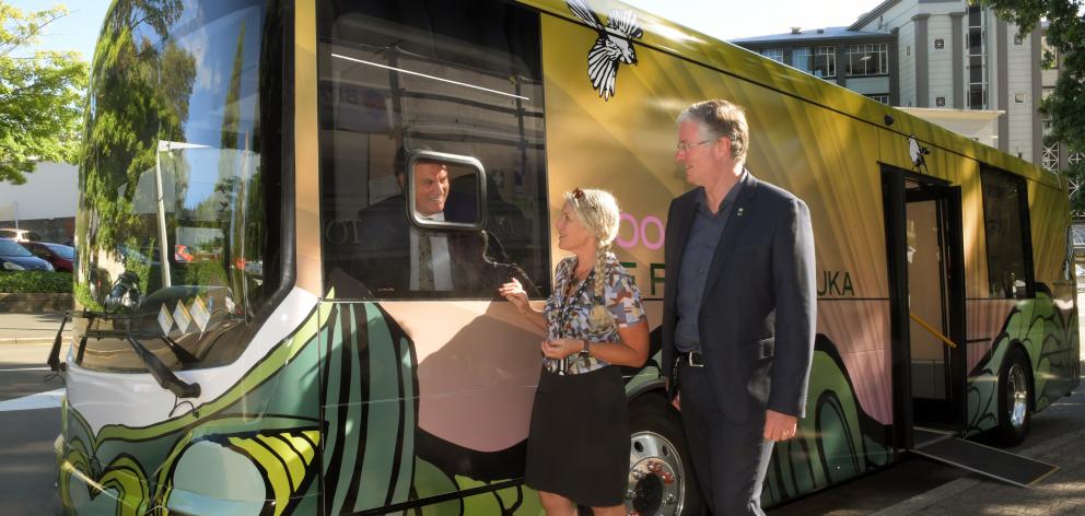 Riding in the newly unveiled electric book bus Dunedin Mayor Jules Radich (left) was given a tour...
