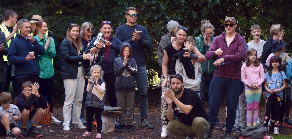 The crowd listens to a musical performance on Saturday.