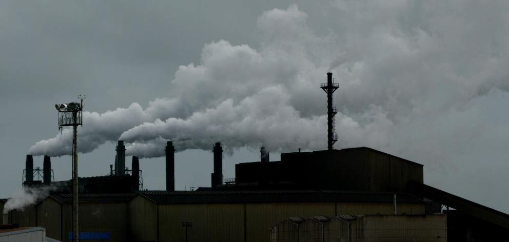 Smoke billows from chimneys at the Glenbrook Steel Mill. PHOTO: THE NZ HERALD