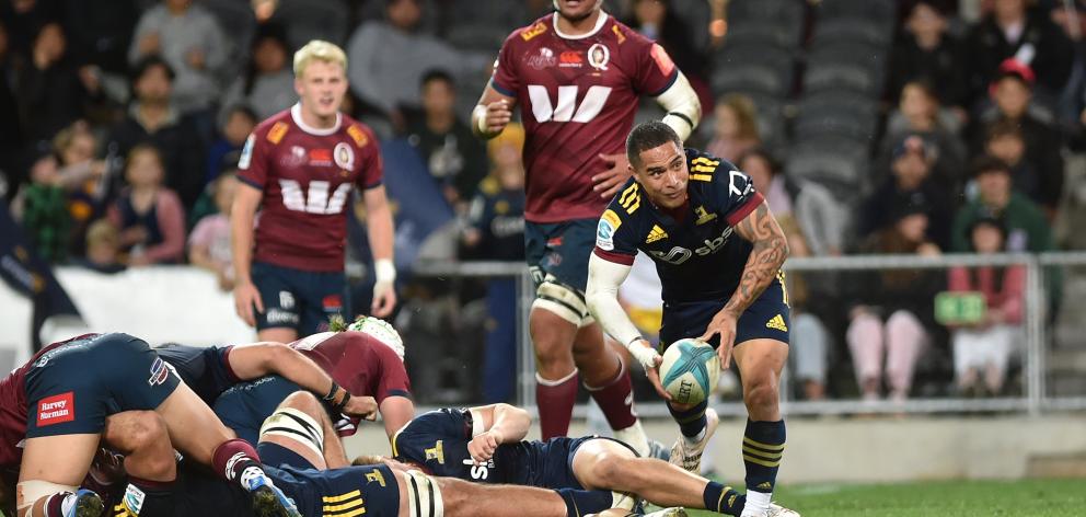 Halfback Aaron Smith, in his final home game for the Highlanders, clears the ball from a ruck...