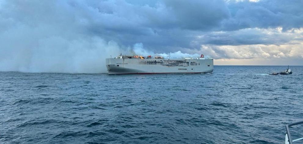 Smoke rises on the cargo ship Fremantle Highway. Photo: Coastguard Netherlands via Reuters