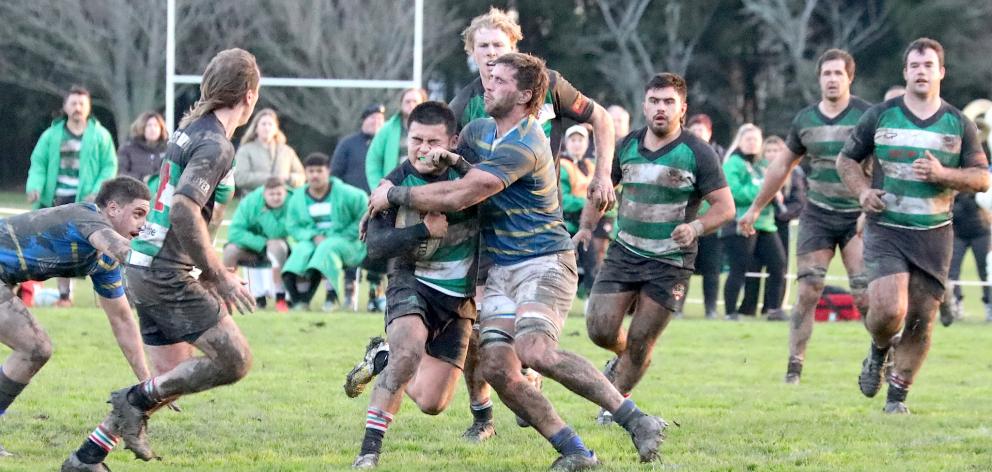 Lincoln University No 8 Joe Brial wraps up Marist Albion first-five Shun Miyake in the two teams...
