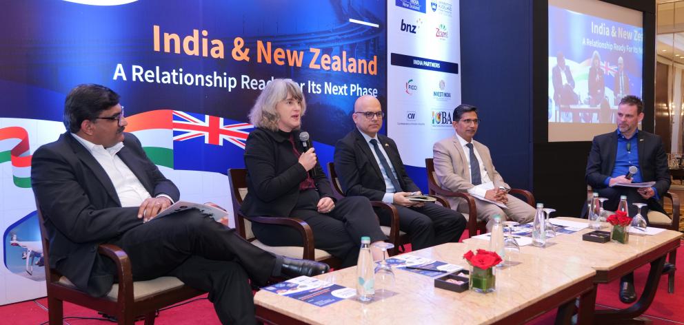 Anna Campbell speaks at a business summit with (from left) Anit Nair from Fisher & Paykel...
