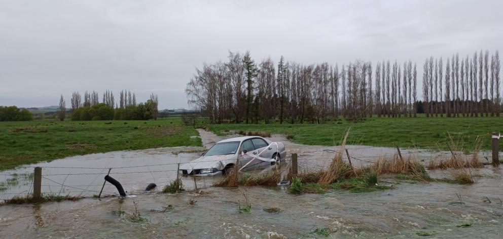Car off the road in flood near Riversdale. Photo: Sandy Eggleston