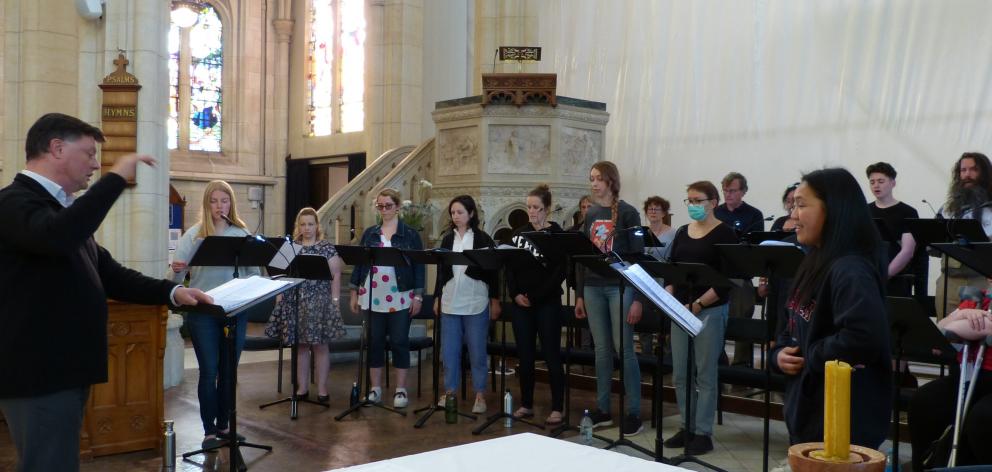 The Southern Consort of Voices rehearse for a concert under the baton of musical director Daniel...
