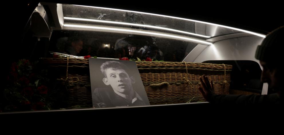 A hearse carrying the coffin of singer Shane MacGowan during his funeral procession in Tipperary....