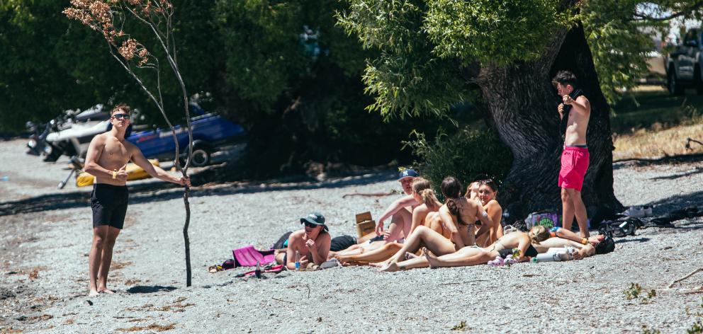 Holidaymakers soak up the sun on the beach at Glendhu Bay. PHOTOS: RHYVA VAN ONSELEN