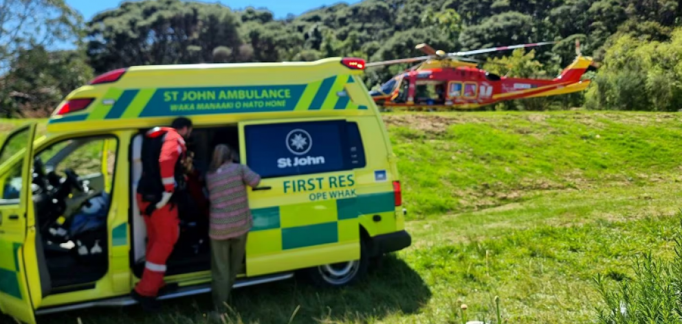 St John ambulance and Auckland Westpac Rescue Helicopter crew tend to Sean Pont. 