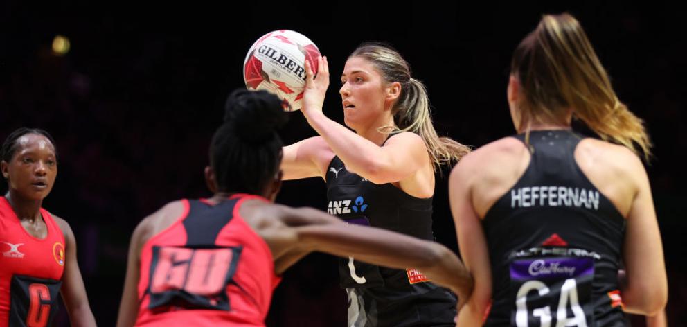 Silver Fern Maddy Gordon looks to pass in the match against Uganda in London. Photo: Getty Images 