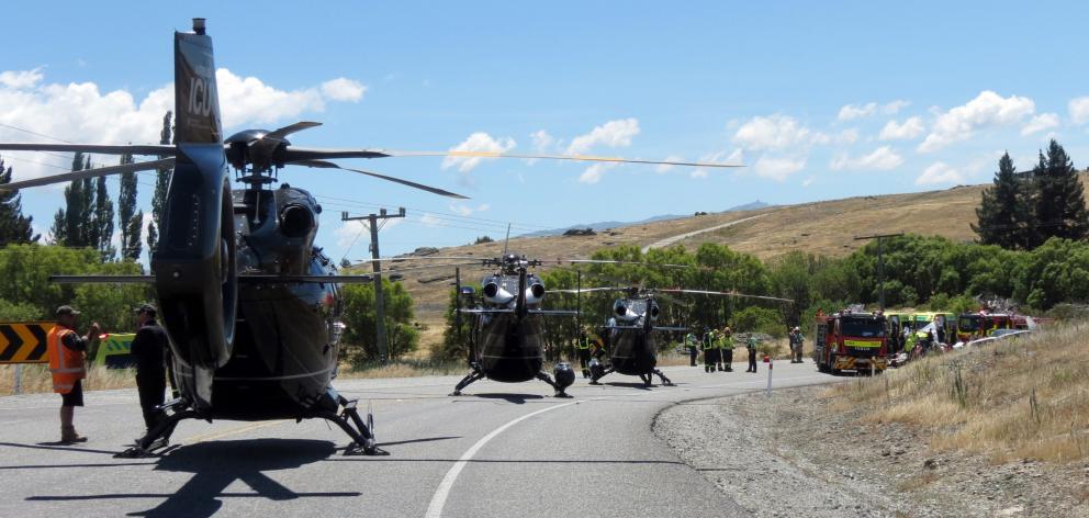 Emergency services, including three helicopters, attend a two-car crash on State Highway 8...