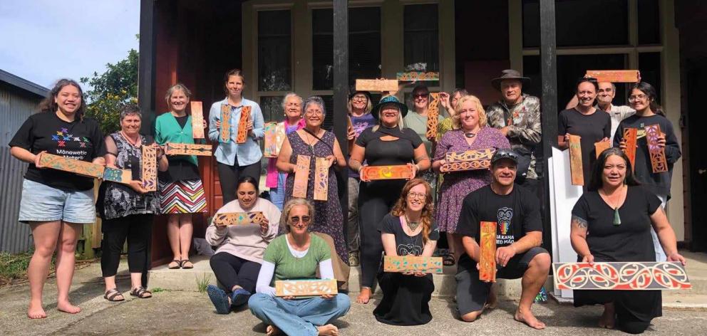 The group show off their finished work. PHOTO: SUPPLIED