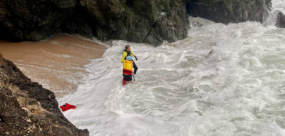A family including a young child had to be rescued after becoming trapped inside a small cave on...