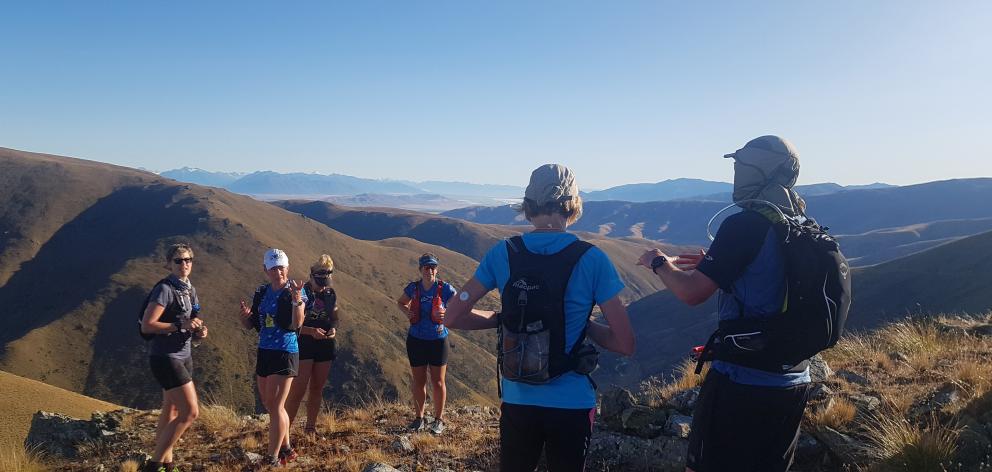 Runners stop to take in the view from Omarama Pass on the way to Patearoa during the 2020 cavalcade.
