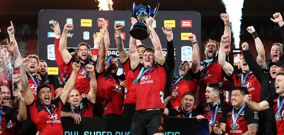 The Crusaders celebrate with the Super Rugby trophy. Photo: Getty Images