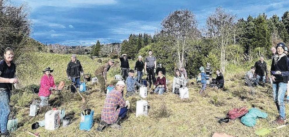 Volunteers at a planting day for the Birdsong Project at the Scargill Motunau Recreational...