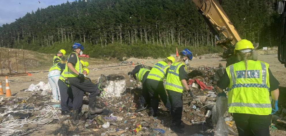 Police scour the Porirua landfill for evidence relating to the death of Helen Gregory. Photo:...