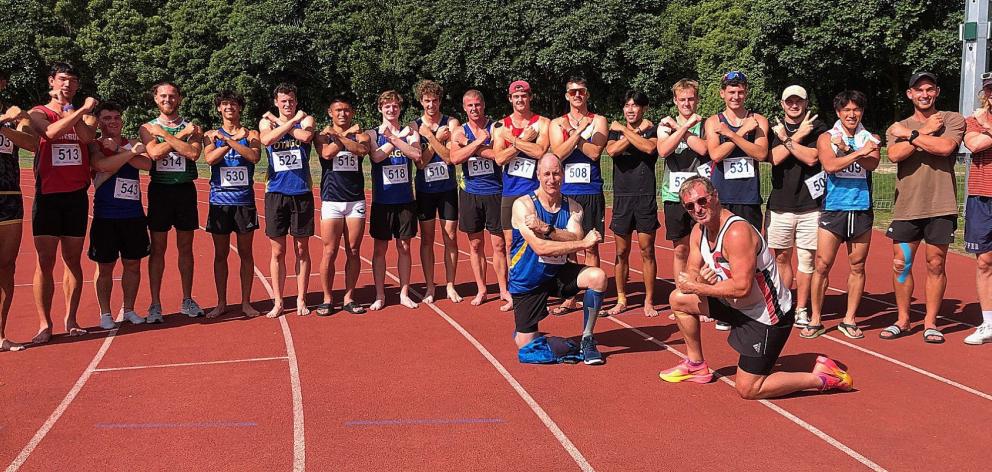 Wayne Doyle (front right) celebrates his latest decathlon victory and newest New Zealand record.