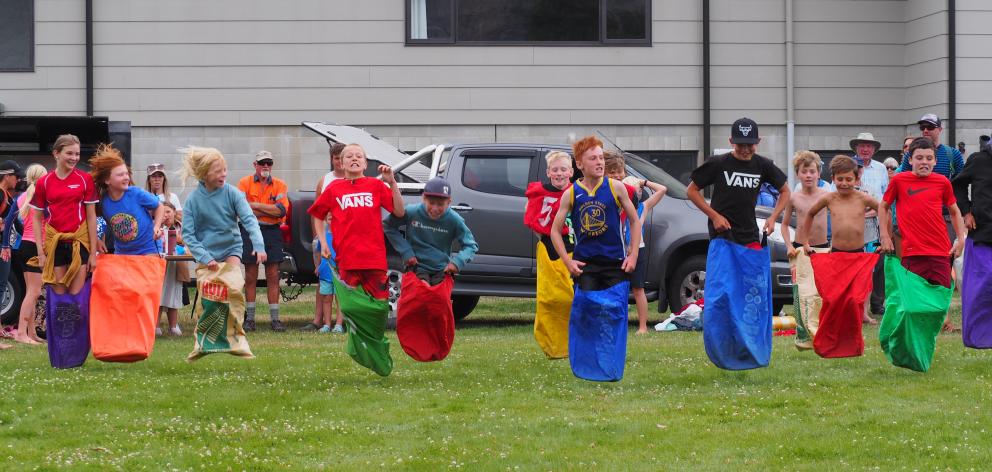 Children take part in a sack race at the Hāwea Waitangi Day celebrations at Peter Fraser Park...